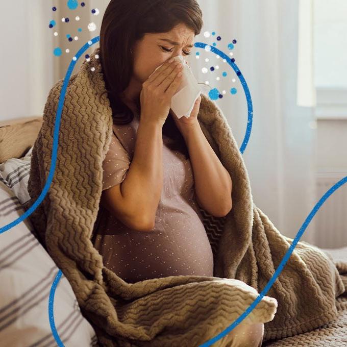 A woman blowing her nose 