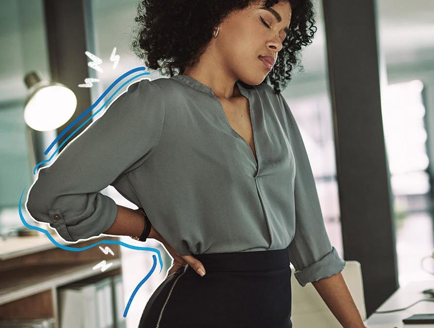 Someone stretching their back in an office