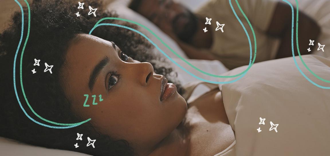 A person sleeping in a bed with someone lying awake next to them surrounded by stars
