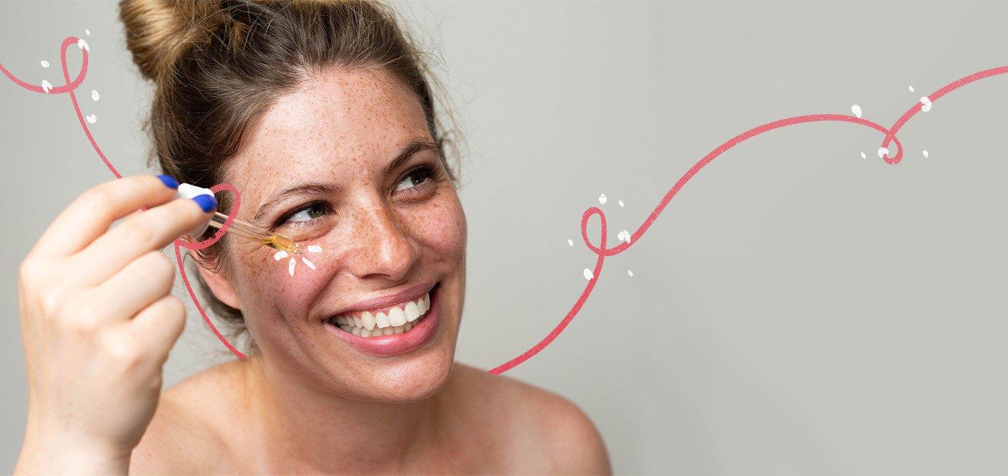 A person applying serum near their eye with a dropper, decorated with a swirling pink line and white dots
